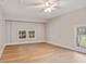 Sun-filled bedroom with hardwood floors and views through large windows at 298 Summerset Ln, Summerville, SC 29483