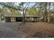 Charming single-story brick home with a covered carport and mature trees, offering curb appeal and convenience at 298 Summerset Ln, Summerville, SC 29483