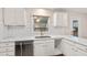 Updated kitchen with new stainless steel dishwasher and a view overlooking the backyard at 298 Summerset Ln, Summerville, SC 29483