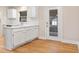 Kitchen features updated cabinets, stainless steel dishwasher and backdoor that leads to back porch at 298 Summerset Ln, Summerville, SC 29483