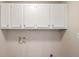 Laundry room space with connections for washer and dryer and overhead storage at 298 Summerset Ln, Summerville, SC 29483
