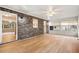 Enclosed sunroom featuring brick accent wall, hardwood floors, fan, and bright windows offering ample natural light at 298 Summerset Ln, Summerville, SC 29483
