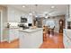 Modern kitchen with white cabinets, granite counters, and an island at 302 Summerset Ln, Summerville, SC 29483