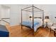 Charming bedroom with hardwood floors and a classic four-poster bed at 305 N Civitas St, Mount Pleasant, SC 29464