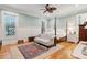 Spacious bedroom with light blue walls, hardwood floors, and a four-poster bed at 305 N Civitas St, Mount Pleasant, SC 29464