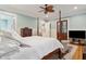 Bright bedroom with hardwood floors, four-poster bed, and light blue walls at 305 N Civitas St, Mount Pleasant, SC 29464
