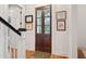 Hallway with a set of wooden french doors, wooden floors and decor at 305 N Civitas St, Mount Pleasant, SC 29464