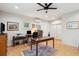 Bright office space features a ceiling fan, hardwood floors, and a spacious layout at 305 N Civitas St, Mount Pleasant, SC 29464