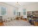 Bright playroom with ample natural light, hardwood floors, and built-in storage at 305 N Civitas St, Mount Pleasant, SC 29464