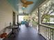 Inviting porch with black floors, blue ceiling, rocking chairs, and outdoor seating at 305 N Civitas St, Mount Pleasant, SC 29464