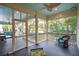 Relaxing screened porch with ceiling fan and comfortable seating at 305 N Civitas St, Mount Pleasant, SC 29464