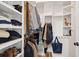 Organized walk-in closet with built-in shelving and hanging rods at 305 N Civitas St, Mount Pleasant, SC 29464