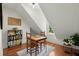 Cozy attic space featuring hardwood floors and a game table set for entertainment at 309 Huntington Rd, Summerville, SC 29483