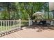 Beautiful back deck with outdoor seating, white railings, and a view of the landscaped backyard at 309 Huntington Rd, Summerville, SC 29483