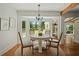 Cozy dining nook has a round table, bay window, and views of the backyard at 309 Huntington Rd, Summerville, SC 29483
