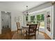 Charming dining area featuring a large window offering views of the landscaped yard at 309 Huntington Rd, Summerville, SC 29483