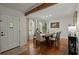 Dining room features hardwood floors, a wood table, and windows with patterned curtains at 309 Huntington Rd, Summerville, SC 29483