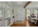 Bright foyer features hardwood floors, a patterned rug, and a view of the dining area at 309 Huntington Rd, Summerville, SC 29483