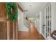 Foyer with hardwood floors, a staircase, and double doors leading into another room at 309 Huntington Rd, Summerville, SC 29483