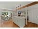 Open-concept kitchen with white cabinets, island with pendant lights, and breakfast nook at 309 Huntington Rd, Summerville, SC 29483