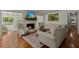 Comfortable living room boasts hardwood floors, wingback chairs, and a brick fireplace at 309 Huntington Rd, Summerville, SC 29483