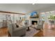 Cozy living room features a brick fireplace, mantle with decor, and hardwood floors at 309 Huntington Rd, Summerville, SC 29483