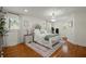 Spacious main bedroom featuring hardwood floors, two large windows, and neutral decor at 309 Huntington Rd, Summerville, SC 29483