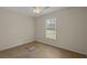 A simple bedroom with a ceiling fan and one window, awaiting personalization and updates at 3308 Comsee Ln, Johns Island, SC 29455