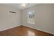 Empty bedroom offers natural light from the window and a ceiling fan for comfort at 3308 Comsee Ln, Johns Island, SC 29455
