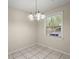 Bright dining area with tiled floors and a window view at 3308 Comsee Ln, Johns Island, SC 29455