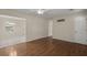 View of open living room with hardwood floors and a doorway to the dining area at 3308 Comsee Ln, Johns Island, SC 29455