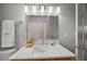 Bathroom featuring a marble countertop, stylish lighting, and modern fixtures at 34 Pinckney St, Charleston, SC 29401