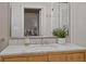 Bathroom vanity featuring a marble countertop, stylish mirror, and decor at 34 Pinckney St, Charleston, SC 29401