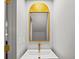 Stylish bathroom boasts a unique gold mirror and modern vessel sink at 34 Pinckney St, Charleston, SC 29401
