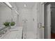 Bright bathroom with glass shower, marble countertop, and modern fixtures at 34 Pinckney St, Charleston, SC 29401