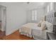 Comfortable bedroom with hardwood floors, neutral tones and bright natural light at 34 Pinckney St, Charleston, SC 29401