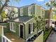 Charming house featuring a deck, light green siding, and a metal roof at 34 Pinckney St, Charleston, SC 29401