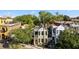 Charming two-story home with a light green exterior, complemented by lush landscaping at 34 Pinckney St, Charleston, SC 29401