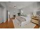Cozy main bedroom features a fireplace, ceiling fan, and plush bedding at 34 Pinckney St, Charleston, SC 29401