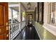 Inviting front porch with dark wood floors and stylish lantern lighting at 34 Pinckney St, Charleston, SC 29401