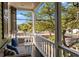 Cozy porch with outdoor seating and a view of the street at 34 Pinckney St, Charleston, SC 29401