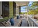Inviting porch with comfortable seating and serene neighborhood views at 34 Pinckney St, Charleston, SC 29401