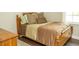 Bedroom featuring a wooden bed with decorative pillows and a side table at 407 Tammie Ave, Goose Creek, SC 29445