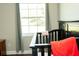 Bedroom displays a black crib next to a window with natural light at 407 Tammie Ave, Goose Creek, SC 29445