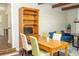 Cozy dining area with wooden table, chairs, and built-in hutch, adjacent to living space at 407 Tammie Ave, Goose Creek, SC 29445