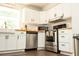 Charming kitchen with white cabinets, butcher block countertops, stainless appliances, and subway tile at 407 Tammie Ave, Goose Creek, SC 29445