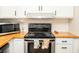 This kitchen features a stainless steel range, hood and microwave at 407 Tammie Ave, Goose Creek, SC 29445