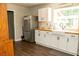 Updated kitchen with stainless appliances, butcher block countertops and white cabinets at 407 Tammie Ave, Goose Creek, SC 29445