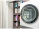 Functional laundry area features shelving and a modern washer/dryer for convenient laundry care at 407 Tammie Ave, Goose Creek, SC 29445