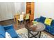 Inviting living room featuring a stylish blue sofa, round table, and dining space at 407 Tammie Ave, Goose Creek, SC 29445
